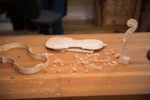 A violin takes shape under the hands of Luthier Garth Lee.