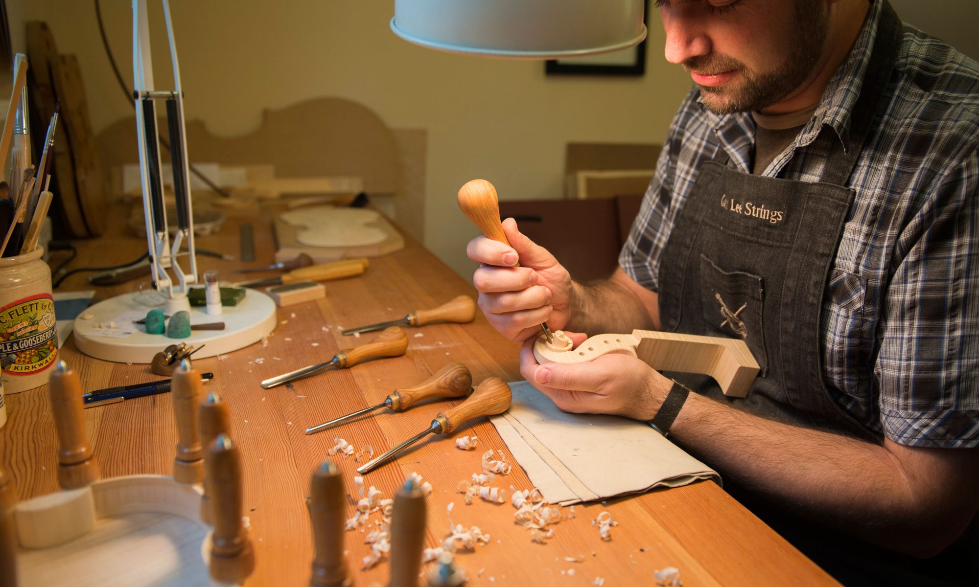 Violin Maker Garth Lee shapes violin and Viola scrolls using traditional tools.